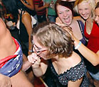 drunk girl in glasses sucking male stripper's cock